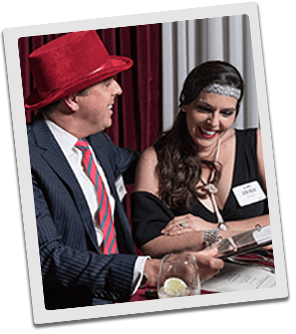 Denver Murder Mystery couple checking out the dinner menu